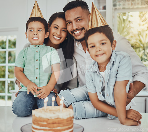 Image of Birthday, portrait and children with parents in a kitchen for cake, celebration and family bonding. Party, cake and kids with mother and father, happy and smile while celebrating, brothers and joy