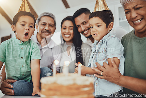 Image of Kid, birthday candles and child with cake at a house at a party with food and celebration. Children, celebrate event and family together in a kitchen with a smile and happiness with parent love