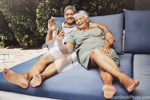 Image of Senior couple, relax and smile for video call, social media or selfie together on outdoor patio at home. Happy elderly man and woman relaxing on comfortable cushion for online chat or communication