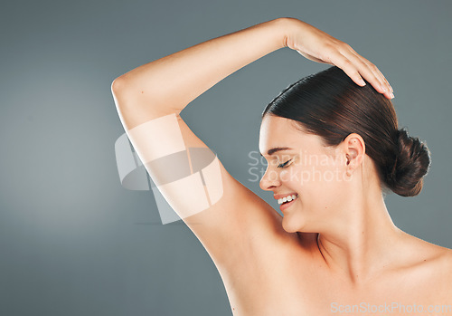 Image of Smile, armpit and woman happy with wellness, health and body smell of a model with studio mockup. Isolated, young female and person with skincare, hygiene and deodorant fragrance underarm with sweat