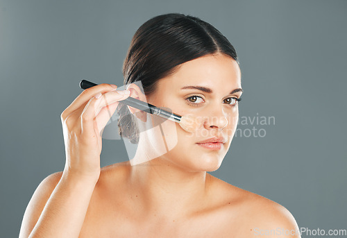 Image of Woman, facial beauty and makeup brush portrait for wellness, cosmetics dermatology and skincare in studio. Model, application and cosmetology lifestyle or luxury product tools for self care glow