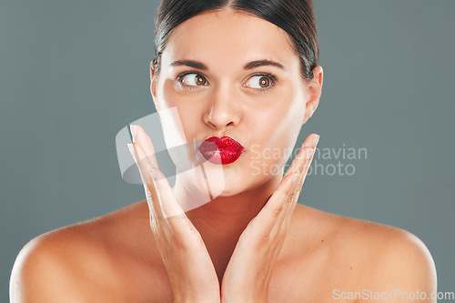 Image of Woman lips with lipstick, kiss face and makeup with red cosmetics and playful pout isolated on studio background. Healthy skin, beauty and skincare with cosmetic care, wellness and facial glow