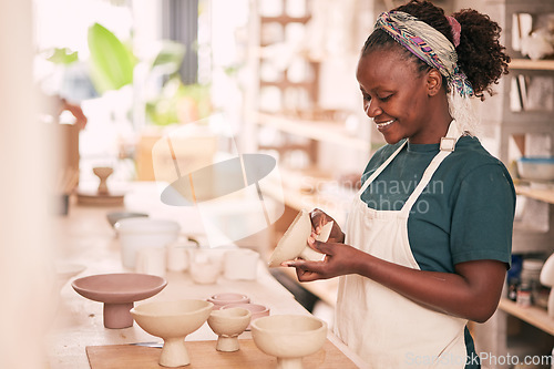 Image of Ceramic store, creative pottery and black woman working on sculpture design mold, manufacturing or art product. Creativity, molding and startup small business owner, worker or girl in studio workshop
