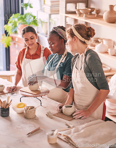 Image of Pottery class, workshop and artist teaching sculpture design, clay manufacturing or art product. Creative mold, ceramic retail store and startup small business owner, woman or team working in studio