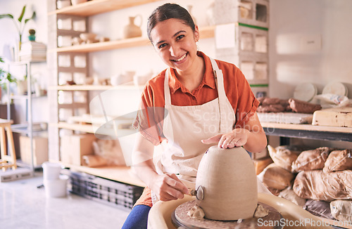 Image of Pottery wheel, workshop portrait and happy woman design sculpture mold, studio manufacturing or art product. Creative, vase molding or startup small business owner, artist or person in ceramic store