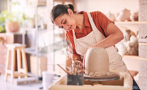 Image of Pottery wheel, workshop and woman mold sculpture design, clay manufacturing production or art product. Creative retail store, craft process or startup small business owner, worker or artist in studio