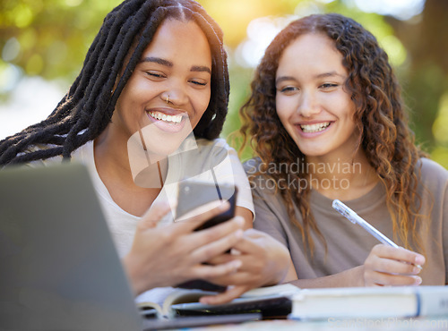Image of Students, women and friends with phone at park laughing at funny meme. University scholarship, comic and happy girls or females with mobile smartphone laugh at joke or crazy comedy on social media.