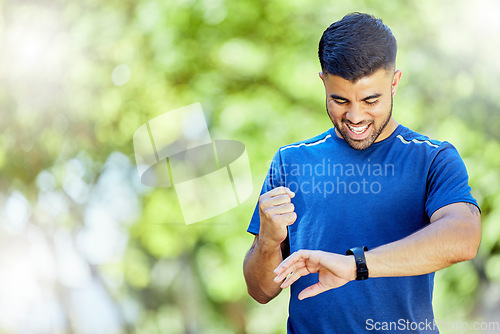 Image of Exercise, mockup and watch with a man cheering his progress as a runner on a cardio or endurance workout. Fitness, running and health with a male athlete celebrating a target or goal while training