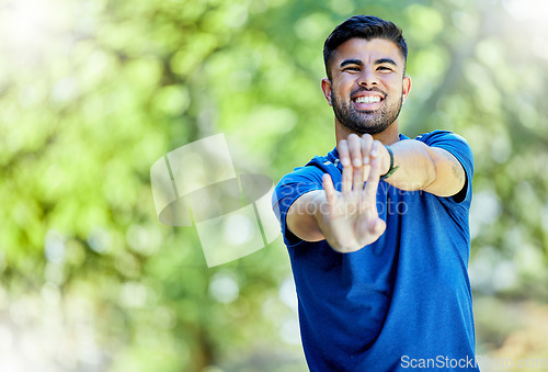 Image of Fitness, mockup and warm up with a sports man outdoor in nature, stretching before exercise. Workout, mock up and training with a male athlete on a natural green background for health or cardio