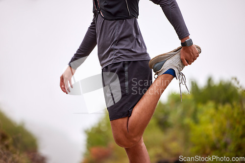 Image of Exercise, balance and man stretching legs on nature trail for running, marathon training and cardio workout. Sports, healthy body and torso of male athlete warm up for wellness, energy and fitness