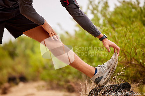 Image of Running, stretching legs and man on nature trail for fitness, marathon training and cardio workout. Sports mockup, healthy body and shoes of male runner warm up for wellness, exercise and performance