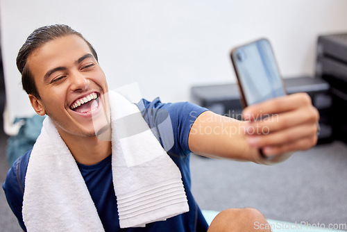 Image of Fitness, man and laugh for selfie, social media or profile picture with towel after workout exercise or training at gym. Happy sporty male vlogger or influencer laughing in happiness for vlog post