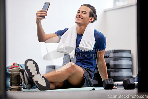 Image of Fitness, happy man and selfie for social media or profile picture with towel after workout exercise or training at gym. Sporty male vlogger or influencer with smile in happiness for online vlog post