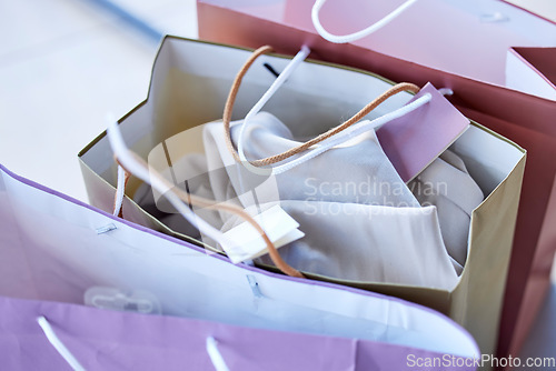 Image of Shopping, bags and retail sale of luxury fashion or clothes of a shopaholic in a store, mall or shop. Wealth, discount and commerce at a boutique with a deal and expensive consumerism for the rich