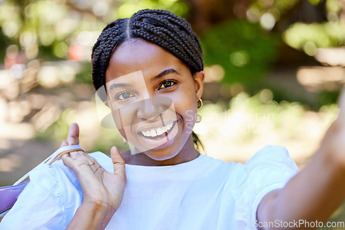 Image of Black woman, shopping and portrait smile for selfie, social media or post in the outdoor park holding bags. Happy African American female shopper, vlogger or influencer smiling for profile picture