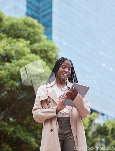 Image of Tablet, business street and black woman in city, internet browsing or research. Tech, employee and low angle of happy female with touchscreen for reading email, networking or social media outdoors.