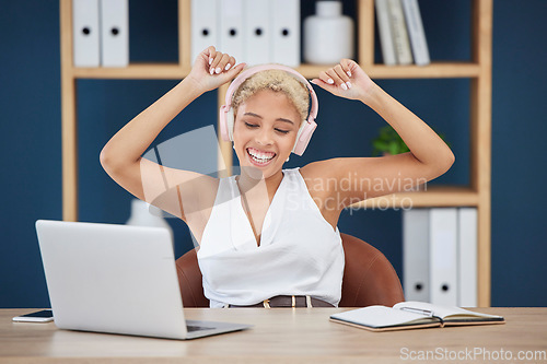 Image of Happy, dance and woman with music from a laptop, listening to the radio and audio in an office. Podcast, playful and dancing employee streaming a sound playlist on a pc with a smile while working