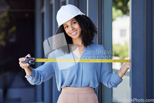 Image of Construction worker, happy in portrait with black woman and tape measure, architecture and building industry. Measurement, architect and engineering contractor in safety helmet and tools in portrait