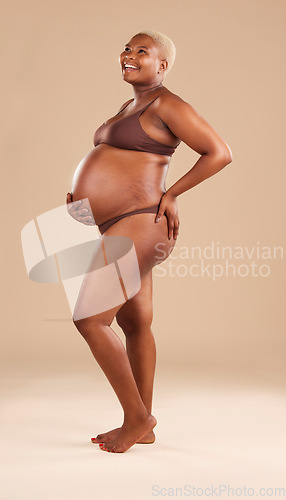 Image of Black woman, laughing or holding pregnant stomach on studio background in body empowerment, love or baby support. Smile, happy and pregnancy model in body underwear or ready for motherhood on mock up