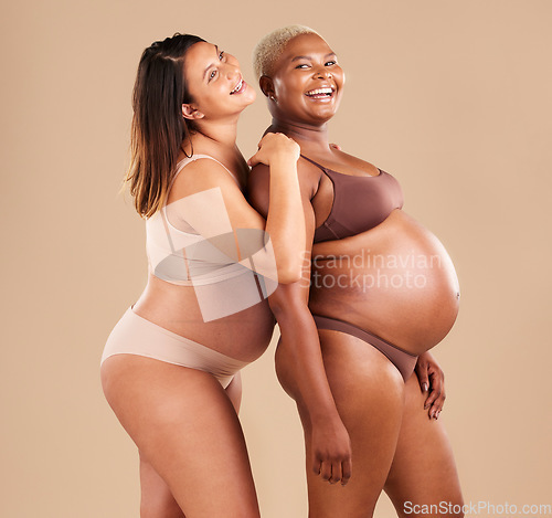 Image of Pregnant, bonding or laughing women on studio background in body empowerment, support or community. Happy smile, diverse or pregnancy friends in underwear and fun joke, baby or family planning mockup