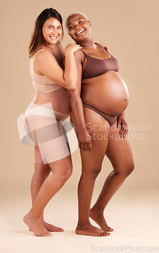 Image of Pregnant body, portrait and bonding women on studio background in body empowerment, love or baby support. Smile, happy and pregnancy mothers in underwear, child family planning or healthcare wellness