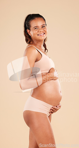 Image of Pregnancy portrait, lingerie or studio woman with smile, happy and excited for baby, stomach growth or motherhood. Gynecology care, maternity wellness or pregnant model with healthcare, love and hope