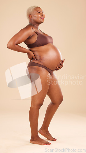 Image of Happy pregnancy, underwear and studio woman with happiness, smile and excited for baby, stomach growth or motherhood. Gynecology, maternity and pregnant African model with healthcare, love and hope