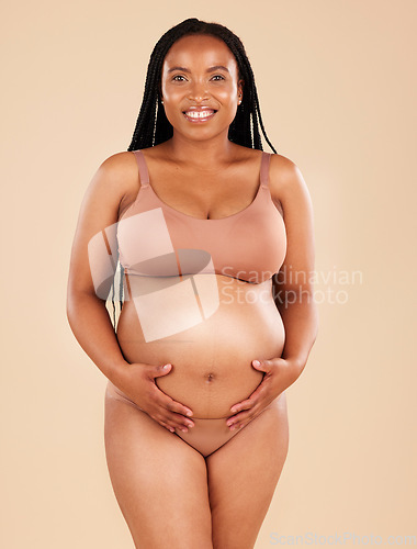 Image of Pregnancy portrait, care and underwear woman with smile, happy and excited for baby, stomach growth or motherhood. Feeling abdomen, maternity or pregnant studio model with healthcare, love and hope