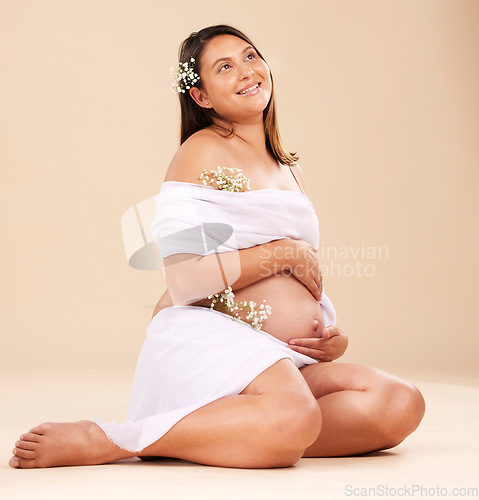 Image of Pregnancy, pregnant woman and smile with flowers sitting, beauty and glow isolated on studio background. Skin, shine and natural cosmetics with nature, happy mother with prenatal cosmetic care mockup