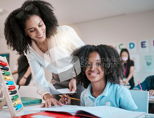 Image of Young child learning maths, happy teacher in classroom with children and knowledge at desk. Female educator writing in workbook, reading kids notebook at school and teaching student with assignment