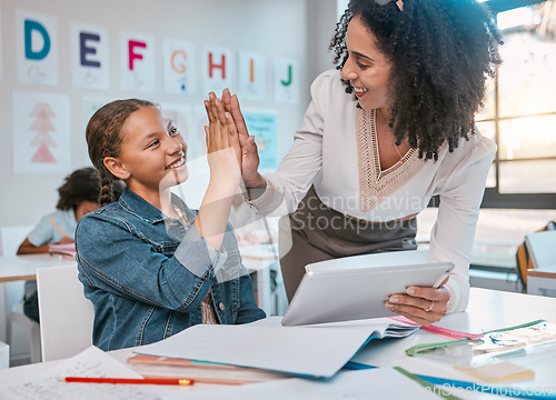 Image of Tablet, high five and teacher with child education, learning and support, achievement and classroom goal. Mentor, black woman or person and girl in success hand sign for English, language development