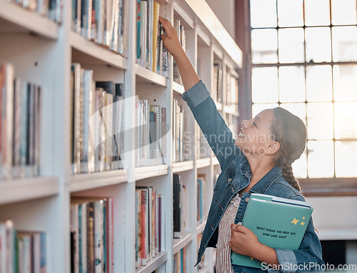 Image of Books, education or child in a library to search for knowledge or development for future learning. Hand reaching, student growth or happy girl studying, information or searching for a story at school
