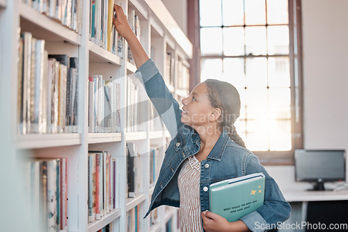 Image of Books, education or girl in a library to search for knowledge or development for future learning. Scholarship, child growth or happy student studying, information or searching for a story at school
