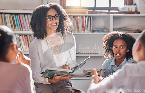 Image of Storytelling, teacher or students with questions in a classroom or library for learning development. Education, kids or children listening to a black woman asking for feedback on fun books at school