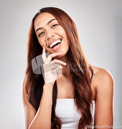 Image of Happy, portrait and woman in studio for hair, beauty and salon treatment on grey background. Face, haircare and model relax with luxury, hair care and shine, keratin and smooth results while isolated