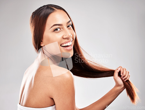 Image of Portrait, happy and woman in studio with strong hair, healthy and salon treatment on grey background. Face, smile and girl model with shine relax after luxury hairstyle, keratin and isolated