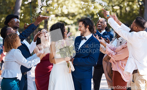 Image of Confetti, wedding couple and marriage celebration of crowd throwing flower petals outdoor. Happiness, excited and social event with bride and man laughing from love and congratulations applause