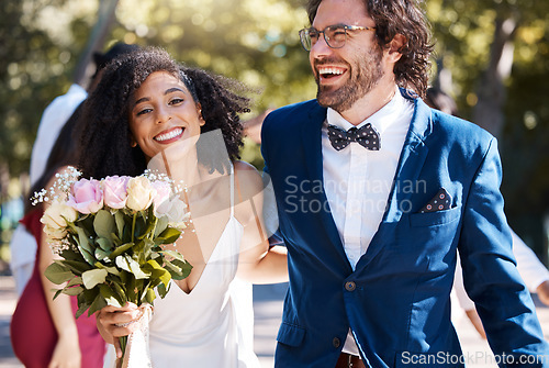 Image of Wedding, happy couple and walking outdoor for marriage celebration event for bride and groom. Married interracial man and woman at ceremony with trust, partnership and a smile with flower bouquet