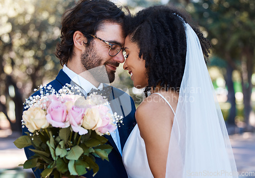 Image of Married couple, flower and forehead with smile for wedding, marriage or loving commitment in the park. Happy groom and bride smiling in happiness for honeymoon, romance and embracing relationship