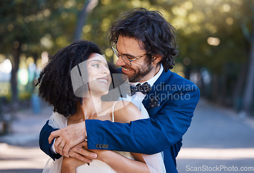 Image of Love, wedding and happy couple outdoor for marriage celebration event together with support. Interracial bride and groom at park with trust, partnership and a hug for commitment and care with a smile