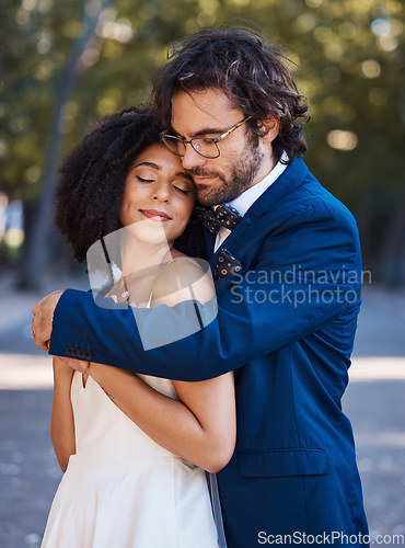 Image of Interracial wedding, black woman and man with hug with smile, happiness or future together. African bride, husband and diversity at outdoor marriage for love, embrace or eye contact in sunshine