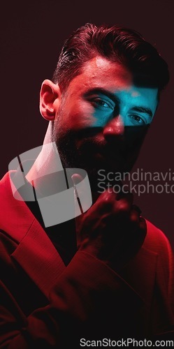 Image of Future, fashion and reflection, portrait of man with eyes in neon lighting with serious expression on face. Futuristic art, male model and beauty with red and blue studio lights on dark background.