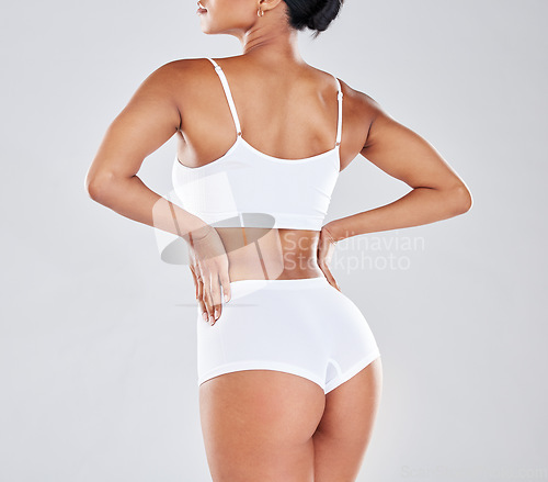 Image of Body, wellness and back of woman after fitness exercise, workout and training to lose weight in studio. Motivation, self care and female model for cellulite treatment, diet and healthy lifestyle