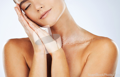 Image of Skincare, beauty and soft skin of woman in studio for natural glow cosmetic product. Aesthetic model person with hands on face for dermatology, wellness and self care with spa treatment results