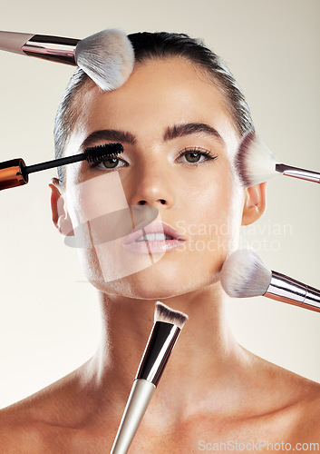 Image of Makeup brush, beauty and face of a woman in studio for cosmetic product advertising. Aesthetic model person with skin tools for facial skincare and dermatology with glow using mascara and foundation