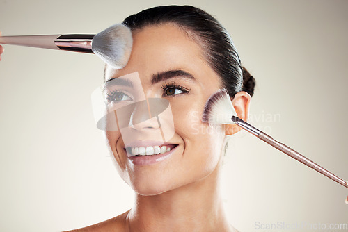 Image of Makeup brush, beauty and face of a woman in studio with a smile for powder cosmetic product. Aesthetic model person happy about facial skincare and dermatology for glow on skin and spa wellness