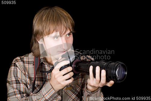 Image of Photographer with the camera with a telefocus lens