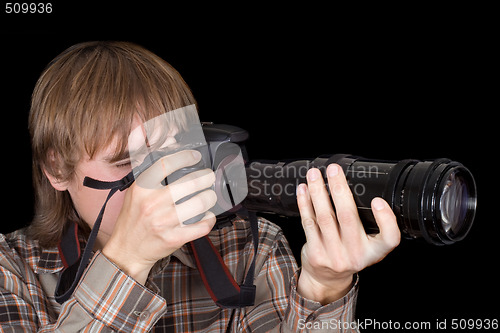 Image of Photographer with the camera with a zoom lens