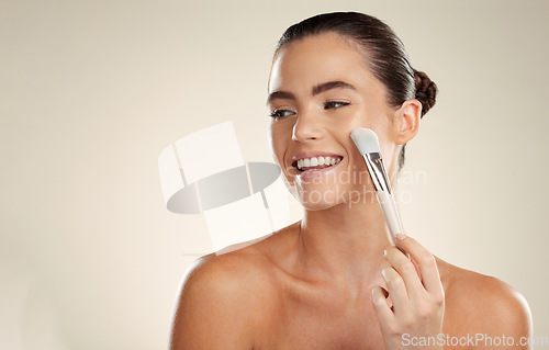 Image of Happy woman, face and makeup brush with smile in beauty mockup, skincare with cosmetics isolated on studio background. Happiness, glow and cosmetic tools, healthy skin and wellness with microblading