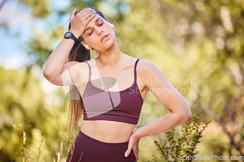 Image of Tired, running and sweat with woman at nature park for workout, cardio or endurance training. Exhausted, breathing and fatigue with girl runner jogging in forest for goal, stamina and exercise